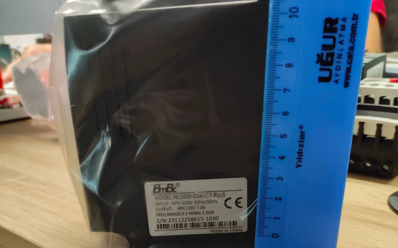 A drive held against a rule to check its dimensions before ordering