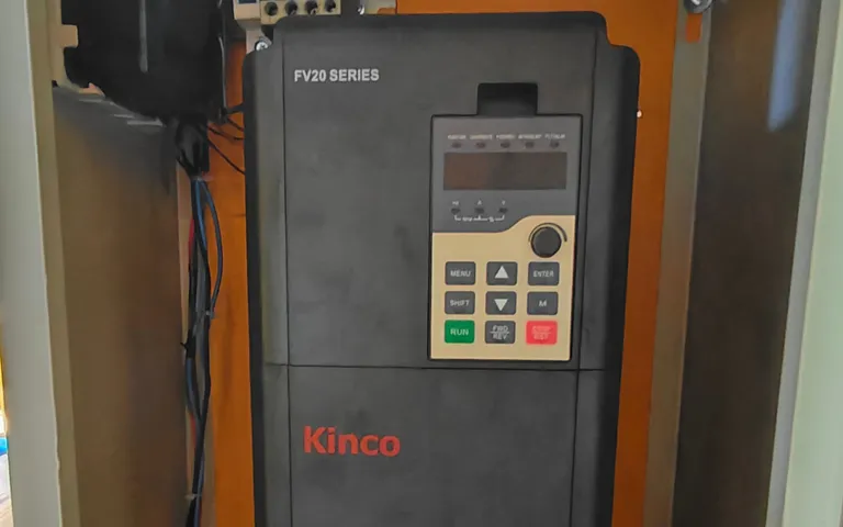 Variable-frequency drive mounted in a pump cabinet with the door open