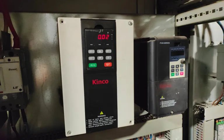 Two drives of different makes mounted side by side in a machine cabinet