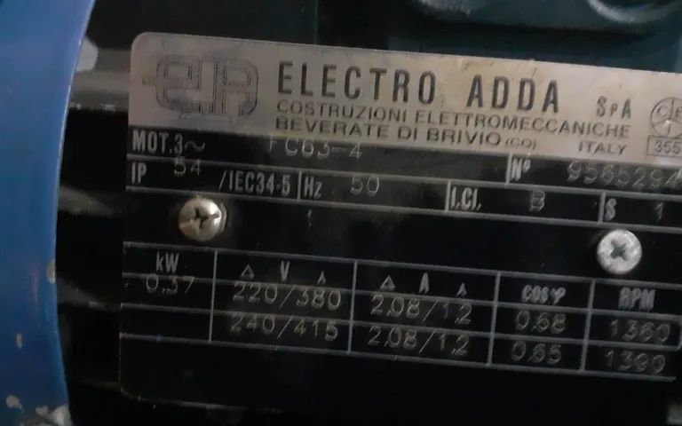 Motor nameplate from another manufacturer showing voltage, current and speed ratings