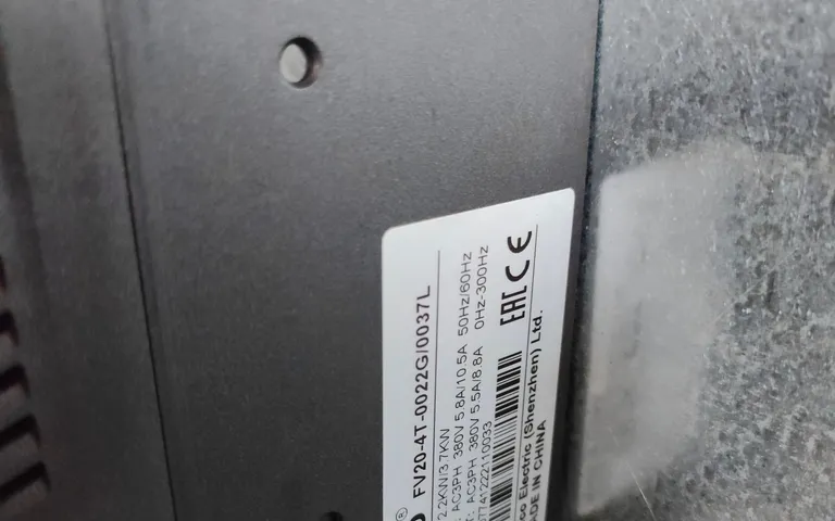 Product nameplate on an installed panel showing model and certification marks