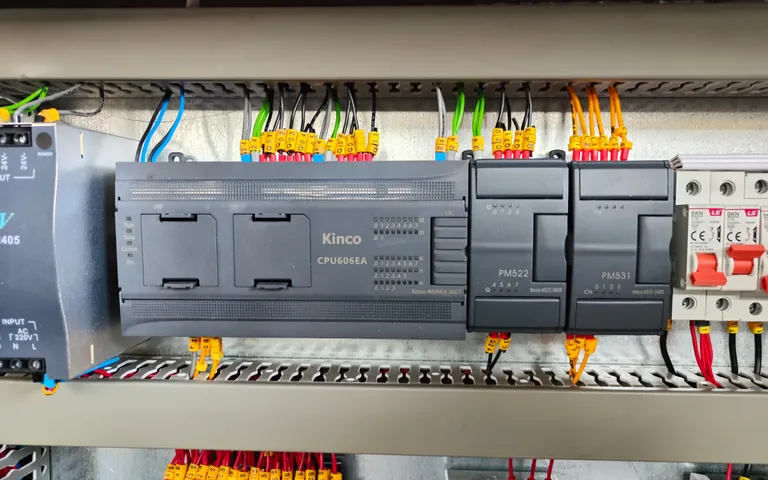 Controller, circuit breakers and terminal rails inside a process cabinet