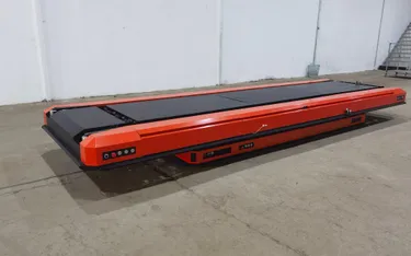 Orange shuttle vehicle in a logistics application
