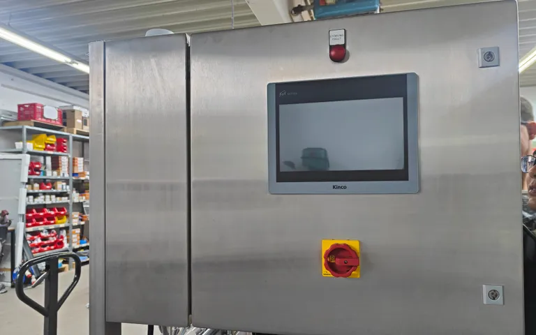 Stainless control panel on a water treatment machine with an interface and selector