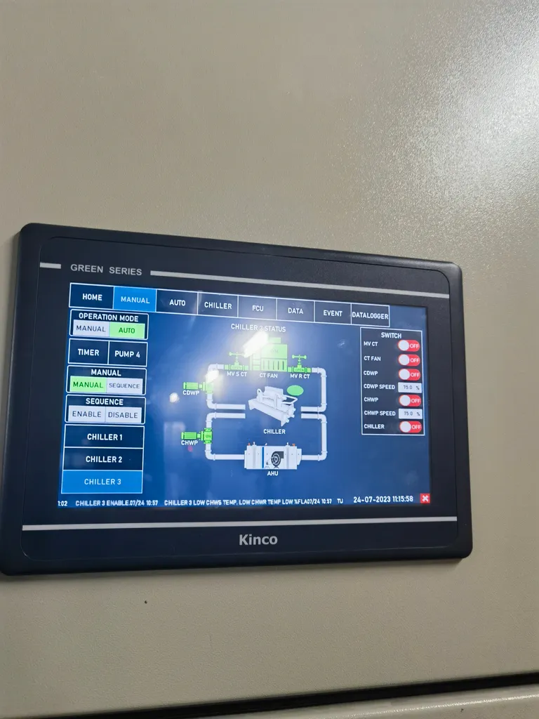 Panel-mounted operator interface showing a chiller sequence screen with pump and valve states