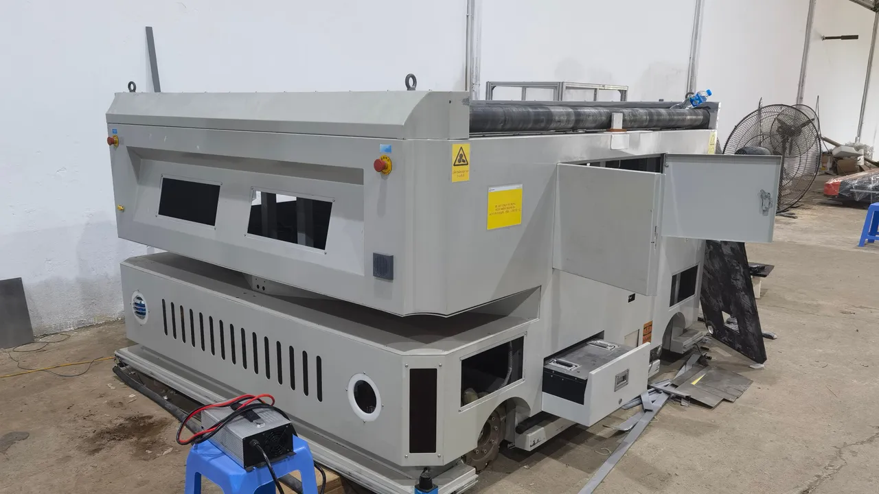 Heavy-load AGV chassis on stands during build, drive units exposed